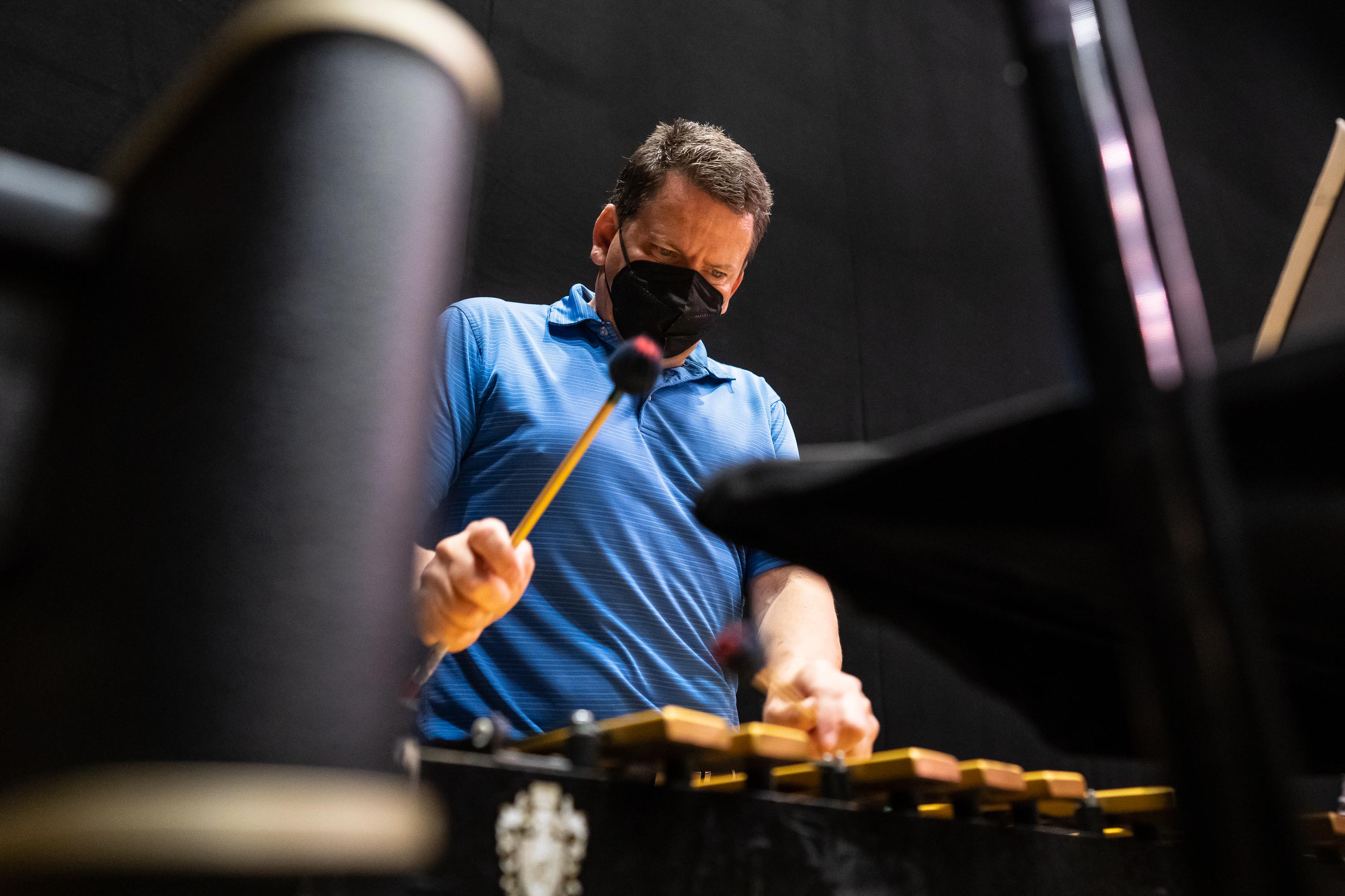 Principal Percussion Christopher Deviney’s sharp focus is apparent during rehearsal