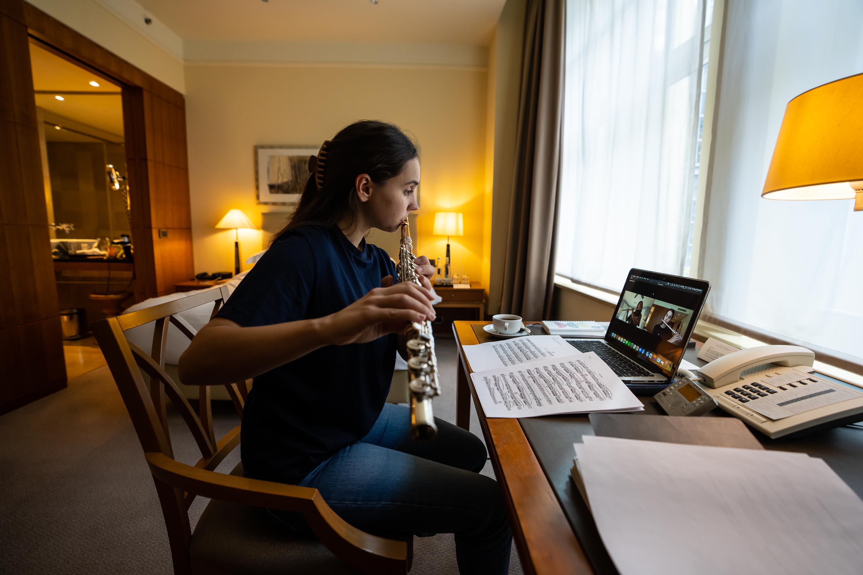Flutist Olivia Staton gave a lesson to one of her students over Zoom from her hotel room