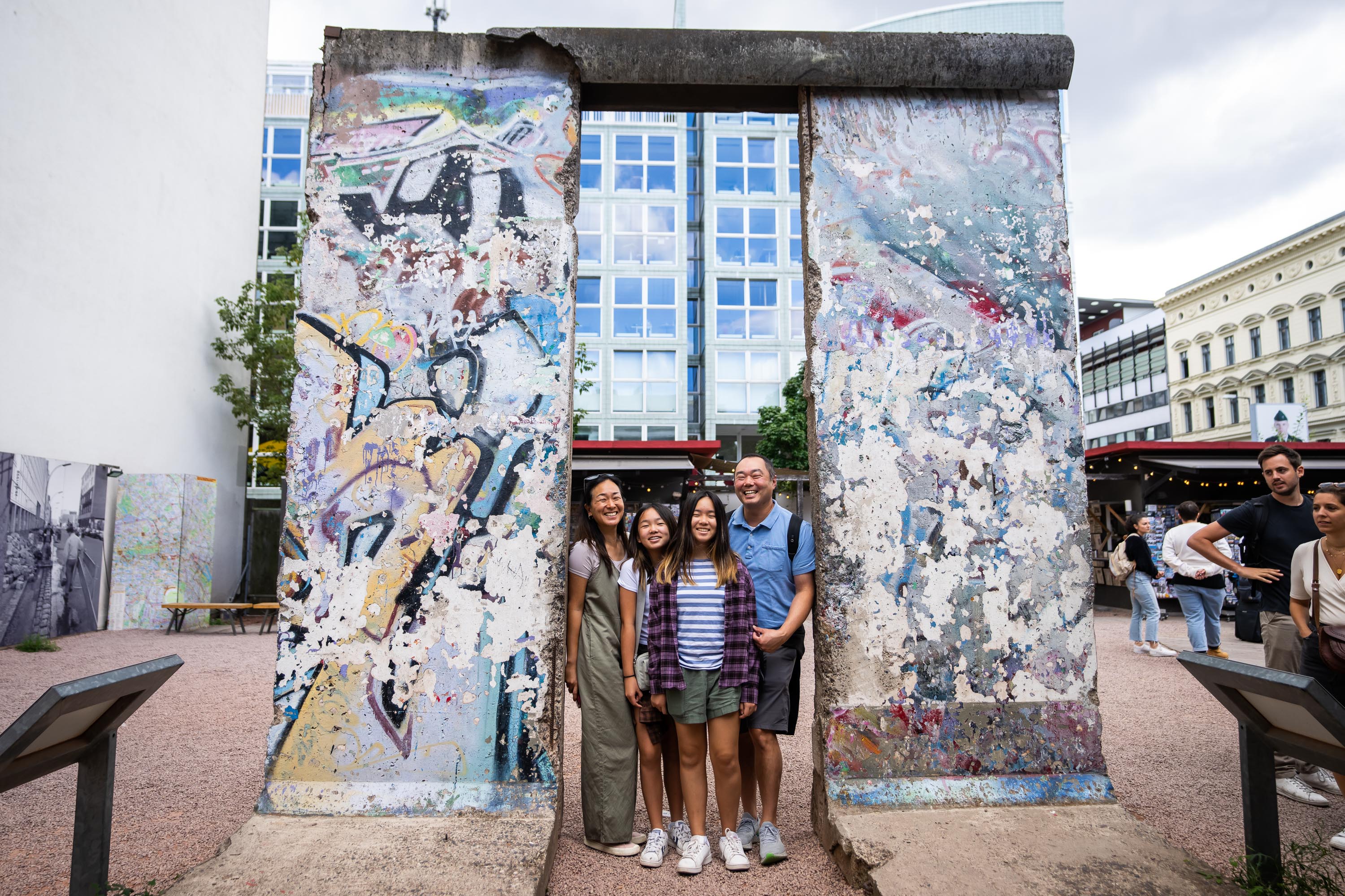 Associate Principal Cello Priscilla Lee, violist Burchard Tang, and their daughters at a section of the old Berlin Wall