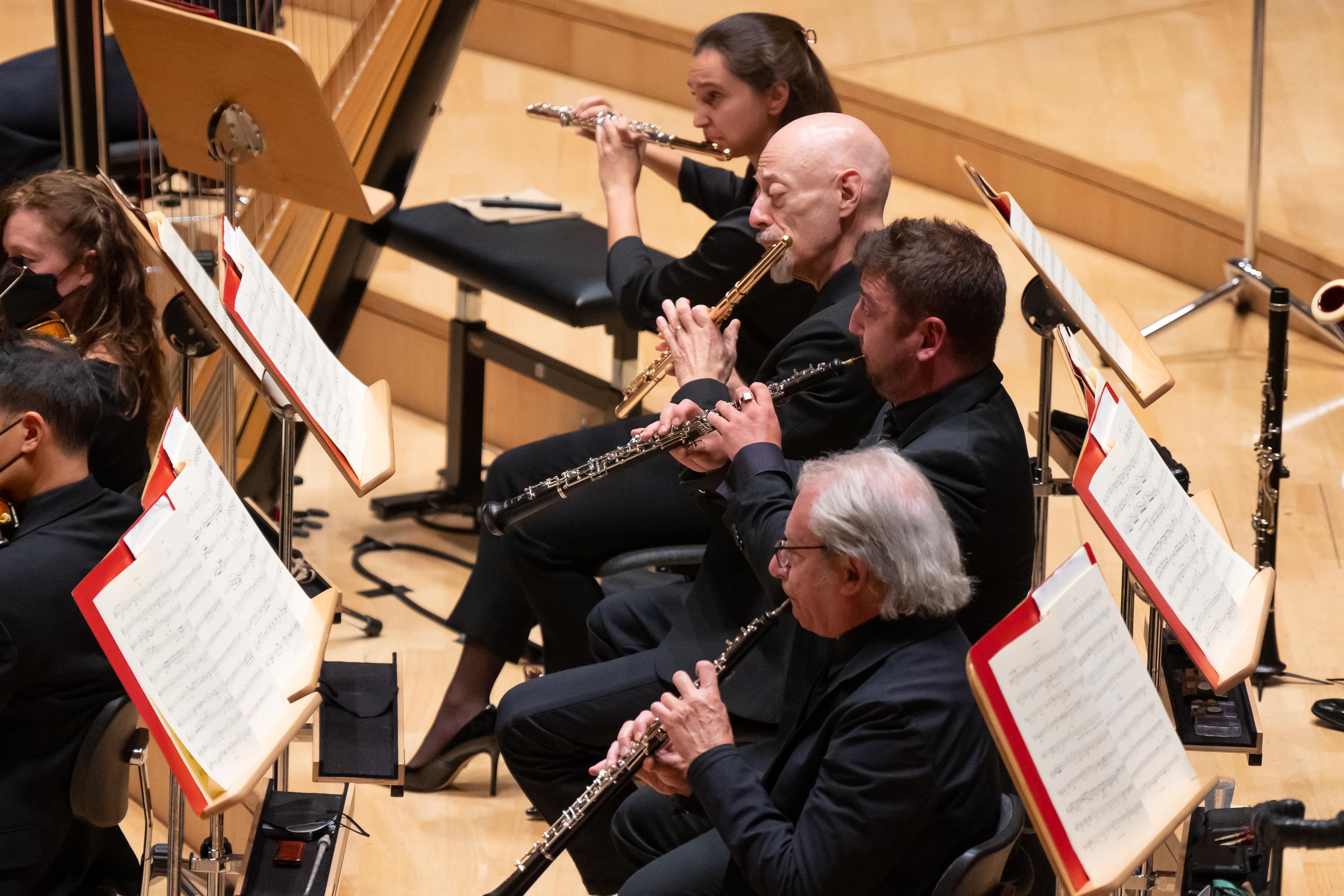 The flute and oboe sections (Olivia Staton, Principal Flute Jeffrey Khaner, Principal Oboe Philippe Tondre, and Jonathan Blumenfeld) shine in the Symphony