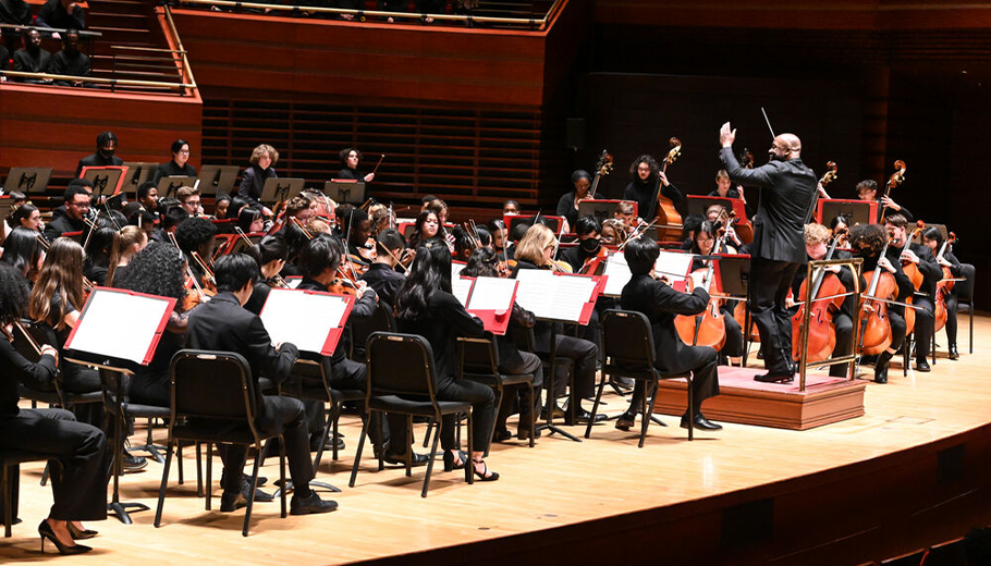 The Philadelphia Orchestra performing on stage.