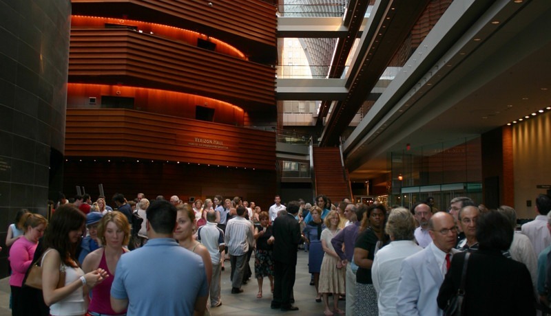 A crowd of visitors walking inside the Kimmel Center.